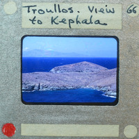 Picture of a scenic view with a body of water and an island, labeled as "View to Kephala" on the front of a film strip.