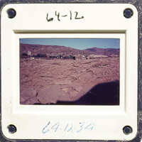 Desert landscape with mountains in the background.