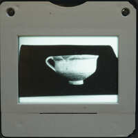 Slide of a photo print of a one handled cup.