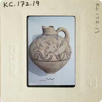 Ancient vase with intricate designs on display.