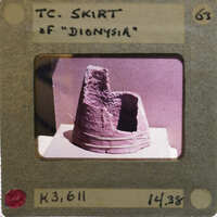 Fragments of terracotta skirt of figurine upright.