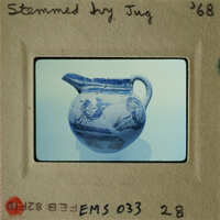 An antique blue and white vase with floral designs.