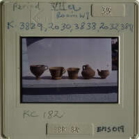 Row of ancient vases on display.