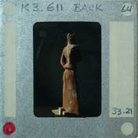 Detail of almost complete terracotta figurine from the back minus right arm.