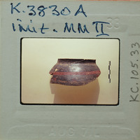 Rim and handle of pot with red horizontal line in profile on white paper K-3830A.