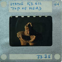 Detail of head of complete terracotta figurine from the top.