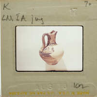 A photo of a jug with a label and date on it.