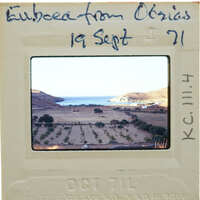 Slide of a coastal landscape with mountains and fields, dated September 1971.