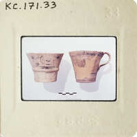 Two ancient Greek vases on display, possibly at a museum.