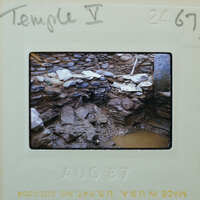 Stone walls with muddy floor surface.