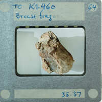 Detail of terracotta figurine breast fragment.