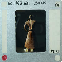 Almost complete terracotta figurine from the back minus right arm.