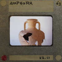 Partially reassembled two handled amphora in profile.
