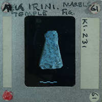 A small blue and black stone artifact.