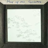 A map of the Galapagos Islands displayed on an antique slide.