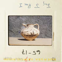 A vase with a floral pattern on it.