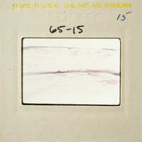 Close-up photograph of a pottery break surface on a film strip.