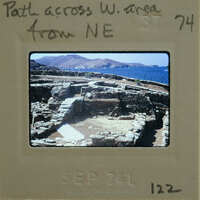 Old photograph of ancient ruins with a sepia tone and film strip border.