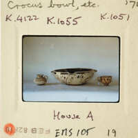Decorative ceramic bowl and cup on display.