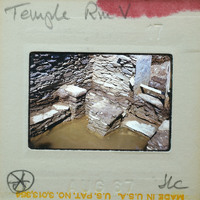 Stone ruins with steps and a muddy area.