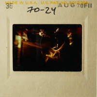 A vintage photo of a dog on a leash, captured in black and white.