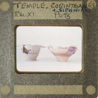 Two clay pots on display.