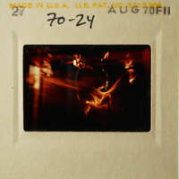 A vintage film strip with a blurry image of a candle flame.