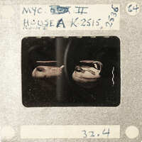 Black and white photograph of a person holding two bowls, with handwritten notes on the border.