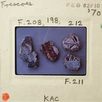 A collection of small, colorful rocks with various patterns and textures.