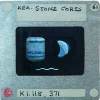 Two small cylindrical stone objects, one broken, K1.118, K1.371.