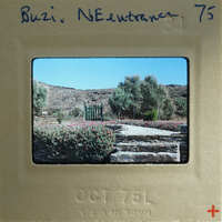 A vintage photograph of a garden with stone steps and greenery, dated October 1976.