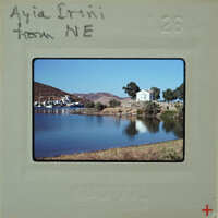 A vintage photo of a scenic lake with mountains and boats, labeled "AIAI CINNI NE" from August 7th.