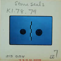 Blue and white label with a barcode, numbers, and symbols on it.