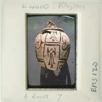 Ancient vase with intricate design on display.