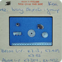 A collection of small, round objects on a blue background with labels and measurements.