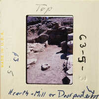 Archaeological site with stone ruins and artifacts.