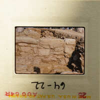 Old stone ruins with sunlight casting shadows on them.