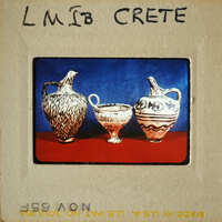 Three vases on display, with two larger ones and one smaller cup-like vessel.