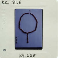 A close-up photograph of a string of beads.