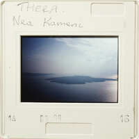 Landscape photograph with clouds and an island in the background.