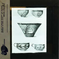 Photo of printed volume showing five vases painted in various styles.