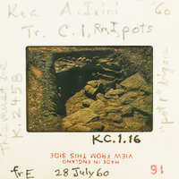 A vintage photograph of a cave with handwritten notes and stamps on the back, dated July 29, 1960.