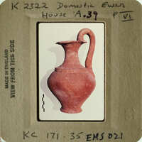 Ancient red clay pottery vase on display.