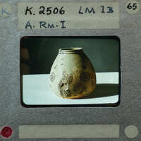 Ancient vase with intricate designs on display, K.2506.