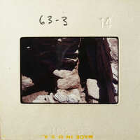 Rocky landscape with stacked stones, possibly part of an old structure.