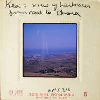 View from road to China with mountains and blue sky.