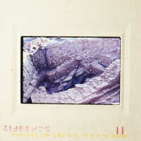 This is an image of a destroyed building, possibly from a natural disaster, captured in color.