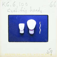 Two stylized marble faces on blue screen.