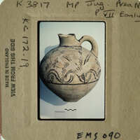 Ancient vase with intricate designs on display.