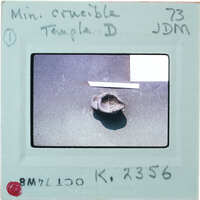 Closeup of very small reassembled pot, identified as a mini crucible K.2356.